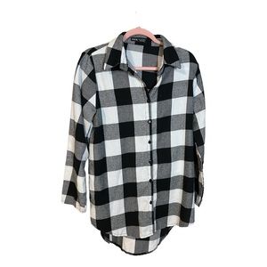 A Checkered button down shirt in size large